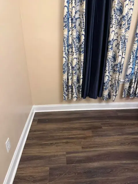 Open kitchen floor space after the range was removed