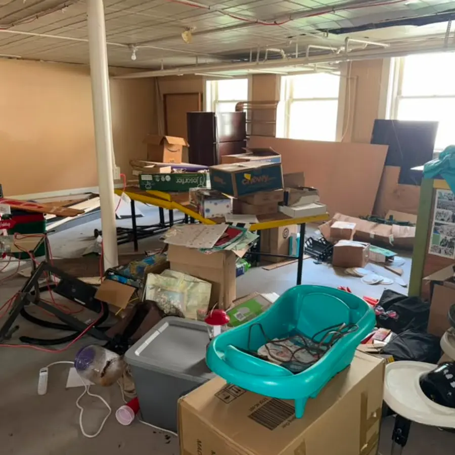 Commercial storage room filled with furniture and boxes