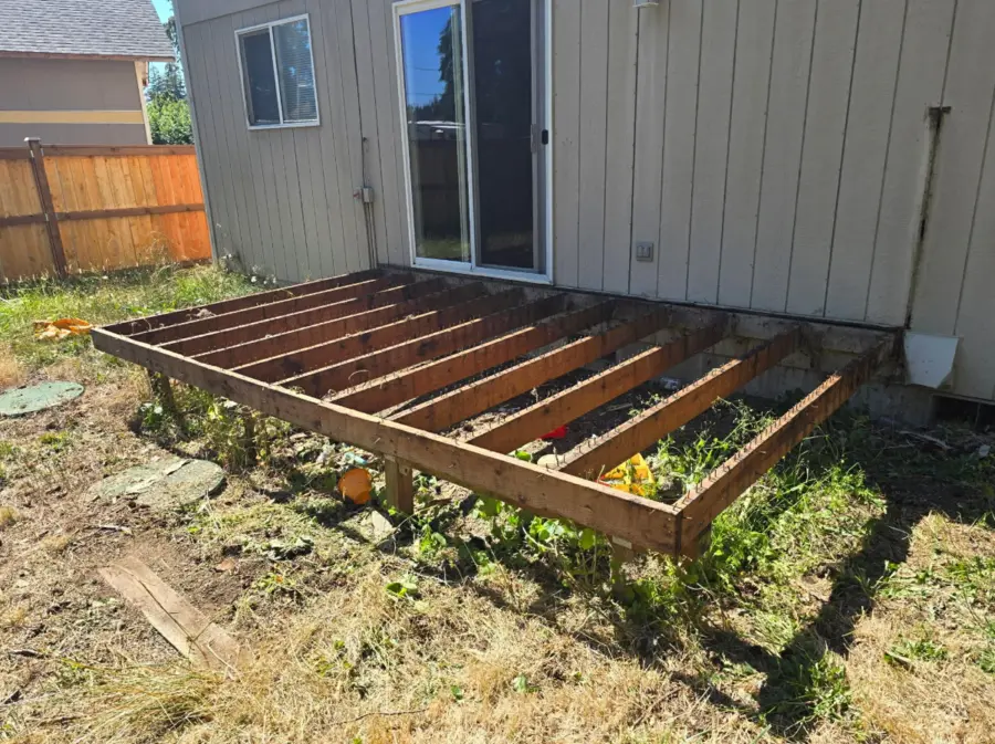 Ground-level deck after decking and railings were removed