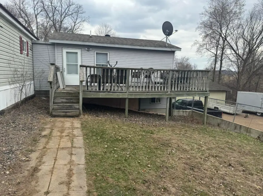 Raised backyard deck and stairs before removal