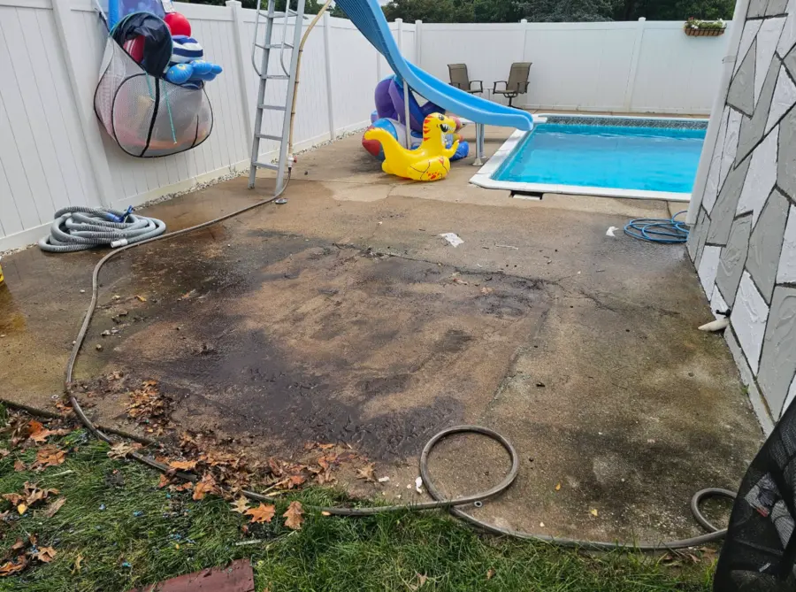 Poolside concrete area cleared after hot tub removal