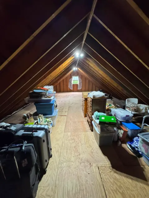 Attic after unwanted items were removed and the walkway was cleared