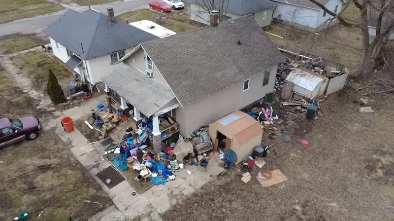 Aerial view of a Central Illinois home and outdoor areas before a large property cleanout