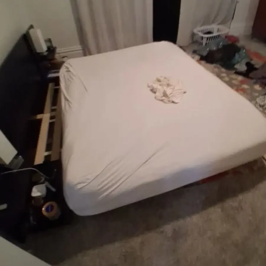 Mattress on a bed before removal