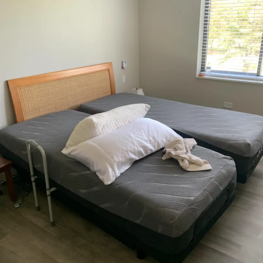 Mattress and bed frame before removal