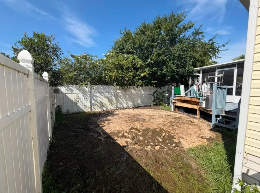 Narrow side yard cleared after pool removal
