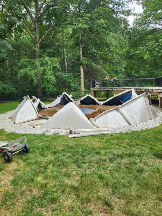 Large damaged above-ground pool before removal