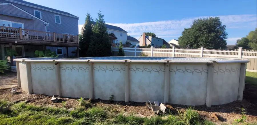 Large steel-wall above-ground pool before dismantling