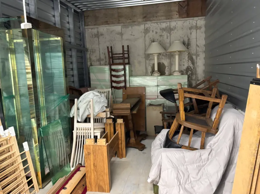 Storage unit with furniture before cleanout