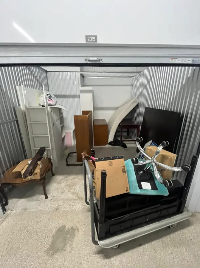 Storage unit with household furniture before cleanout